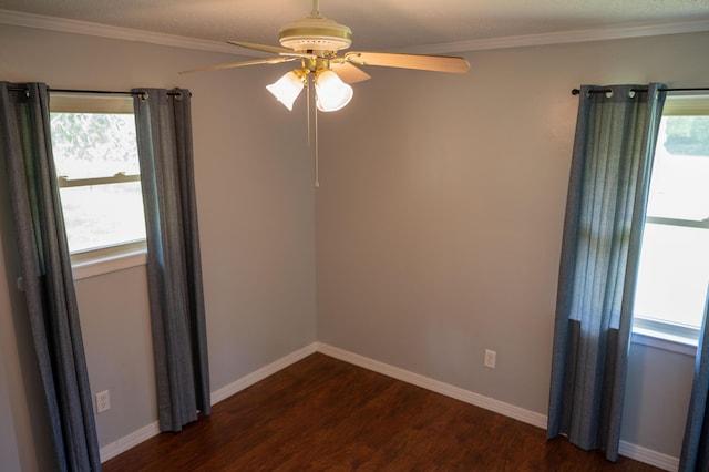 3180 Palmetta Ave, Crestview, FL 32539 - empty room featuring ceiling fan, dark wood-style flooring, and ornamental molding
