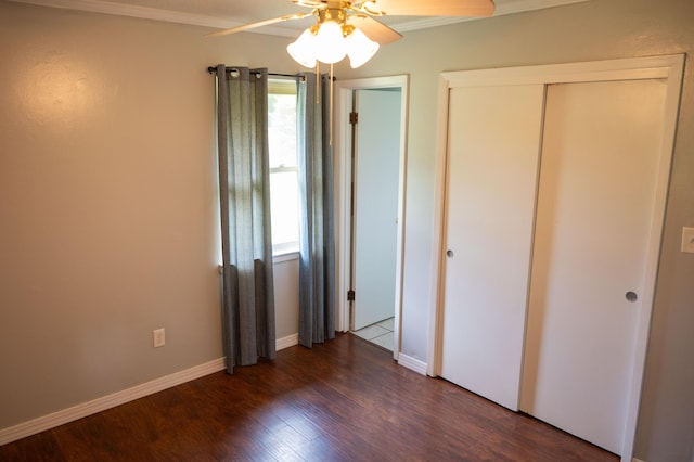 3180 Palmetta Ave, Crestview, FL 32539 - unfurnished bedroom featuring crown molding, dark wood-style floors, and ceiling fan