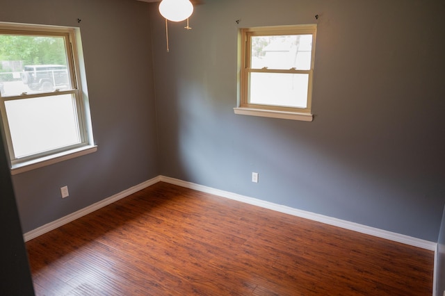3180 Palmetta Ave, Crestview, FL 32539 - spare room with healthy amount of natural light, wood finished floors, and a ceiling fan