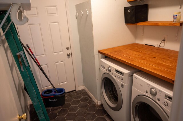 3180 Palmetta Ave, Crestview, FL 32539 - laundry area with washer and clothes dryer and dark tile patterned floors