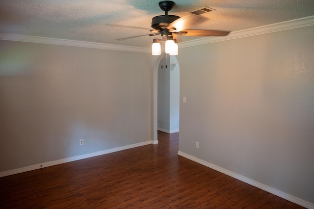 3180 Palmetta Ave, Crestview, FL 32539 - spare room with a ceiling fan, arched walkways, dark wood-style flooring, ornamental molding, and a textured ceiling