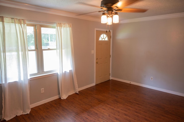 3180 Palmetta Ave, Crestview, FL 32539 - entryway featuring ornamental molding, dark wood-type flooring, ceiling fan, and a textured ceiling