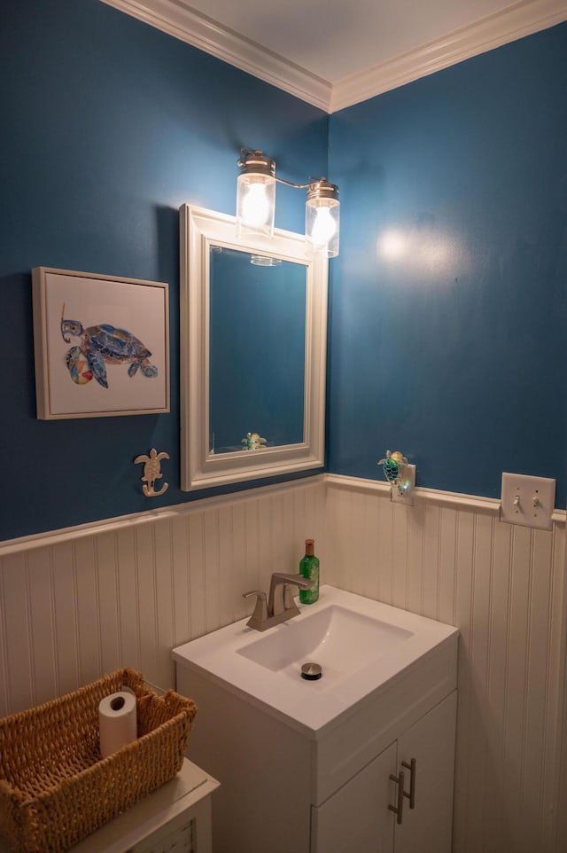3180 Palmetta Ave, Crestview, FL 32539 - bathroom with vanity, a wainscoted wall, and crown molding