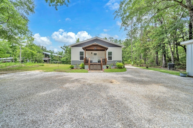52 Lazy Bone St, Vernon, FL 32462 - view of front of home with a porch and gravel driveway