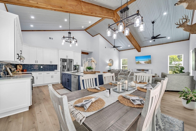 52 Lazy Bone St, Vernon, FL 32462 - dining room with a chandelier, ceiling fan, high vaulted ceiling, healthy amount of natural light, and light wood-style flooring