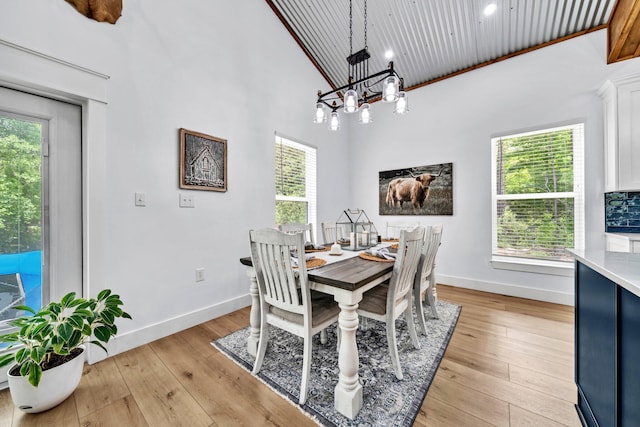 52 Lazy Bone St, Vernon, FL 32462 - dining area with light wood-style floors, a chandelier, and a towering ceiling