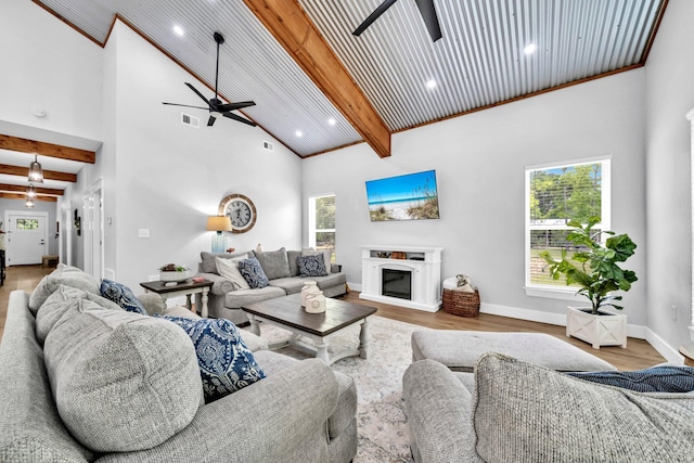 52 Lazy Bone St, Vernon, FL 32462 - living room with a ceiling fan, high vaulted ceiling, beam ceiling, a glass covered fireplace, and wood finished floors