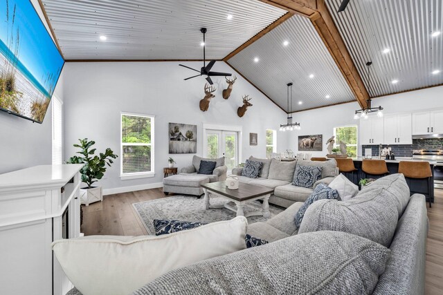 52 Lazy Bone St, Vernon, FL 32462 - living room with high vaulted ceiling, wood finished floors, recessed lighting, ceiling fan, and a chandelier