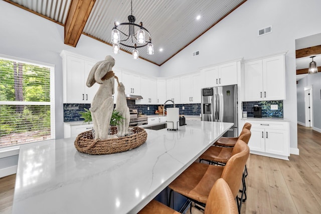 52 Lazy Bone St, Vernon, FL 32462 - kitchen featuring appliances with stainless steel finishes, light wood finished floors, white cabinets, a chandelier, and recessed lighting