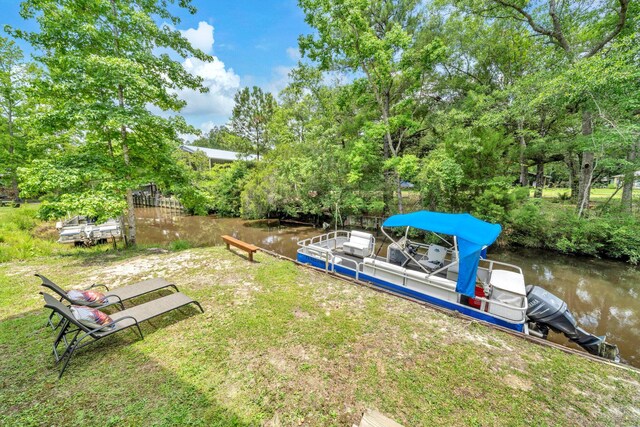 52 Lazy Bone St, Vernon, FL 32462 - view of yard with a water view, a boat dock, and view of wooded area
