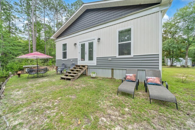 52 Lazy Bone St, Vernon, FL 32462 - back of house featuring french doors, entry steps, and a lawn