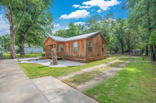 201 Anderson St, Crestview, FL 32536 - rustic home with a storage shed and a metal roof
