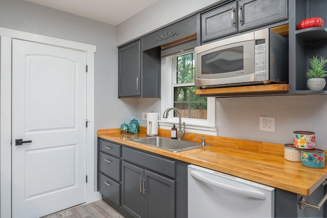 201 Anderson St, Crestview, FL 32536 - kitchen with dishwasher, gray cabinetry, butcher block countertops, and stainless steel microwave