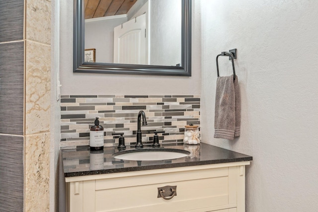 201 Anderson St, Crestview, FL 32536 - bathroom featuring vanity and tasteful backsplash