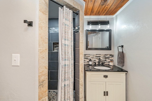 201 Anderson St, Crestview, FL 32536 - bathroom featuring backsplash, tiled shower, and vanity