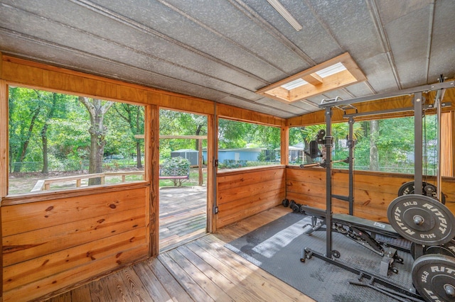201 Anderson St, Crestview, FL 32536 - sunroom / solarium with a skylight, lofted ceiling, and view of wooded area