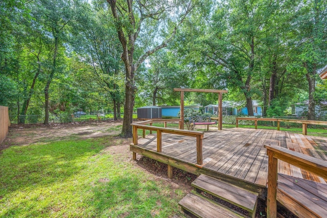 201 Anderson St, Crestview, FL 32536 - deck with a storage shed and a fenced backyard