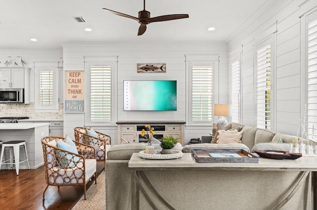 137 Cabana Trl, Santa Rosa Beach, FL 32459 - living area featuring ornamental molding, a ceiling fan, dark wood-style flooring, healthy amount of natural light, and recessed lighting