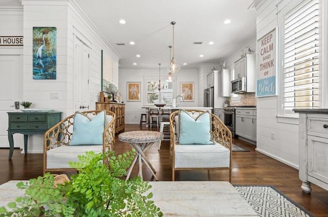 137 Cabana Trl, Santa Rosa Beach, FL 32459 - living area featuring dark wood-style floors, crown molding, and recessed lighting