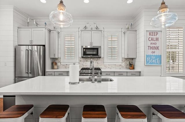 137 Cabana Trl, Santa Rosa Beach, FL 32459 - kitchen with stainless steel appliances, backsplash, ornamental molding, pendant lighting, and recessed lighting