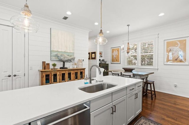 137 Cabana Trl, Santa Rosa Beach, FL 32459 - kitchen featuring ornamental molding, dishwasher, light countertops, dark wood-type flooring, and pendant lighting