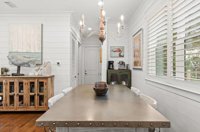 137 Cabana Trl, Santa Rosa Beach, FL 32459 - dining space with crown molding, a chandelier, and wood finished floors