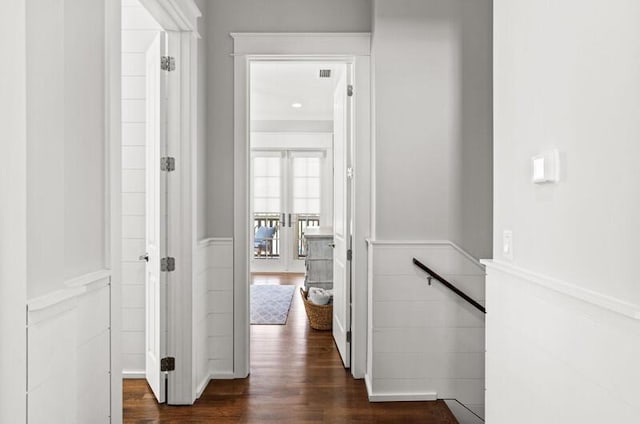 137 Cabana Trl, Santa Rosa Beach, FL 32459 - hall featuring a wainscoted wall, dark wood finished floors, and a decorative wall