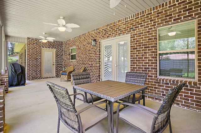 3112 Evans Ave, Navarre, FL 32566 - view of patio / terrace with a ceiling fan, outdoor dining area, area for grilling, and french doors