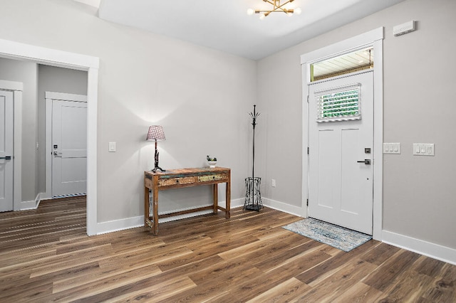 3112 Evans Ave, Navarre, FL 32566 - foyer with wood finished floors and a chandelier