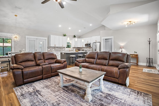 3112 Evans Ave, Navarre, FL 32566 - living room featuring a ceiling fan, wood finished floors, and high vaulted ceiling