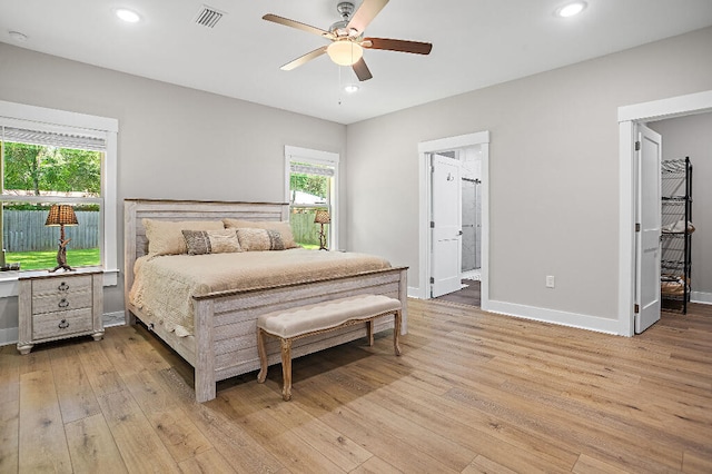 3112 Evans Ave, Navarre, FL 32566 - bedroom featuring light wood finished floors, recessed lighting, a ceiling fan, and connected bathroom
