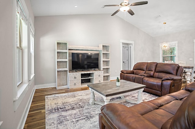 3112 Evans Ave, Navarre, FL 32566 - living room featuring ceiling fan, vaulted ceiling, dark wood finished floors, and a chandelier