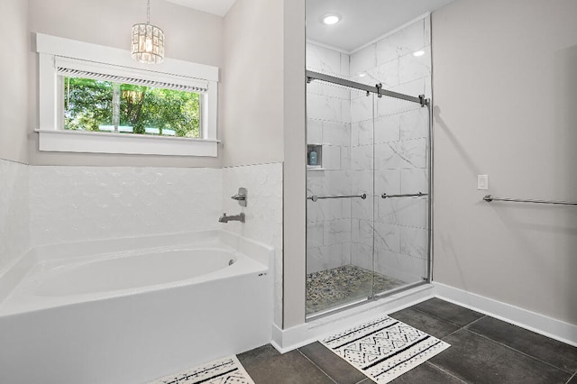 3112 Evans Ave, Navarre, FL 32566 - bathroom featuring a bath, a shower stall, and a chandelier