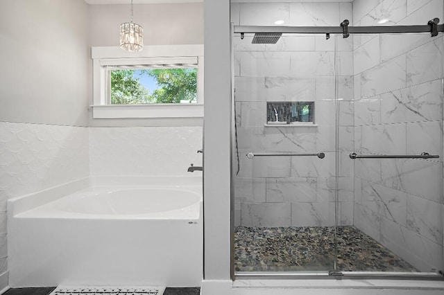 3112 Evans Ave, Navarre, FL 32566 - bathroom featuring a bath, a shower stall, and a chandelier