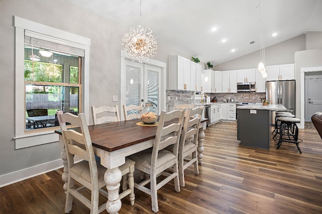 3112 Evans Ave, Navarre, FL 32566 - dining area featuring a chandelier, vaulted ceiling, dark wood-type flooring, and recessed lighting