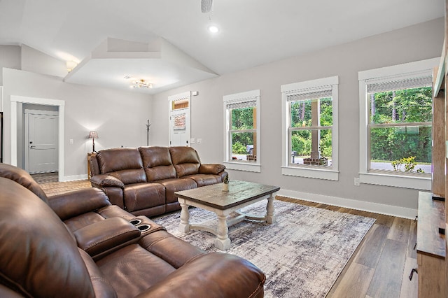 3112 Evans Ave, Navarre, FL 32566 - living room with lofted ceiling, plenty of natural light, wood finished floors, and recessed lighting