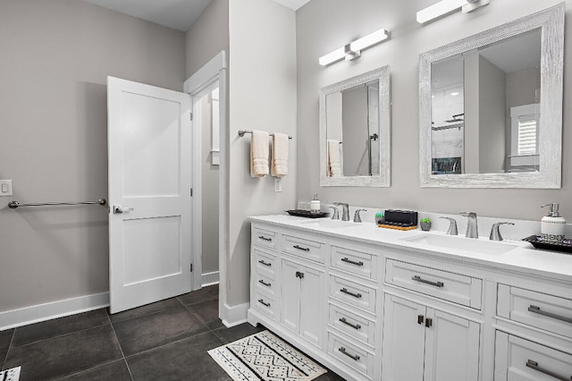 3112 Evans Ave, Navarre, FL 32566 - bathroom featuring baseboards and double vanity