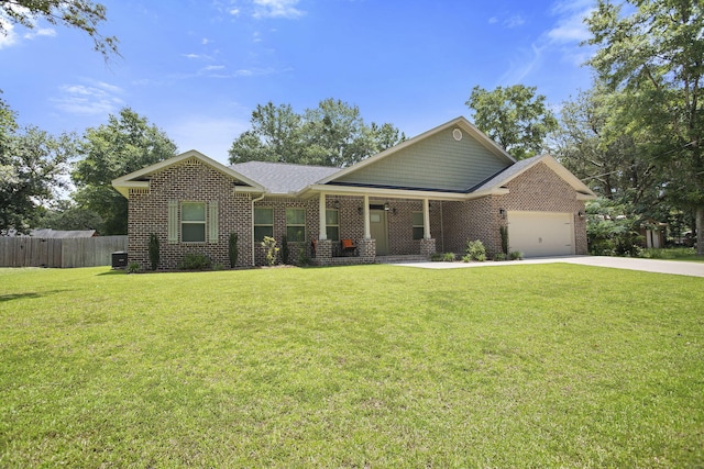 3112 Evans Ave, Navarre, FL 32566 - view of front of home with driveway, an attached garage, brick siding, and a porch