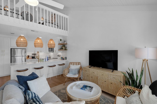 4984 W County Highway 30a Unit 5B, Santa Rosa Beach, FL 32459 - living area with wood finished floors and ceiling fan