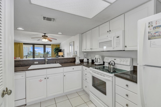 291 Scenic Gulf Dr Unit 400, Miramar Beach, FL 32550 - kitchen with white appliances, dark countertops, white cabinets, ceiling fan, and recessed lighting