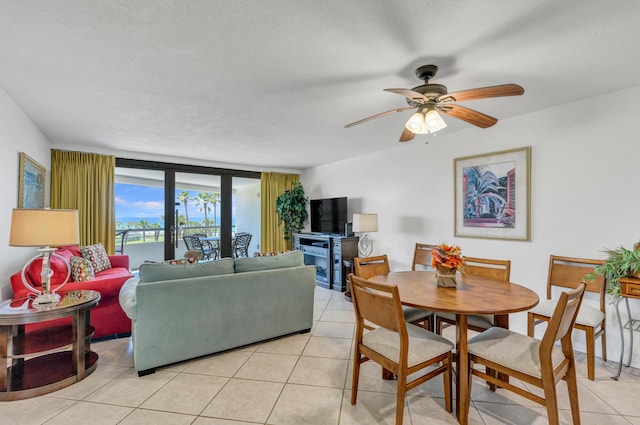 291 Scenic Gulf Dr Unit 400, Miramar Beach, FL 32550 - living room with light tile patterned floors and a ceiling fan