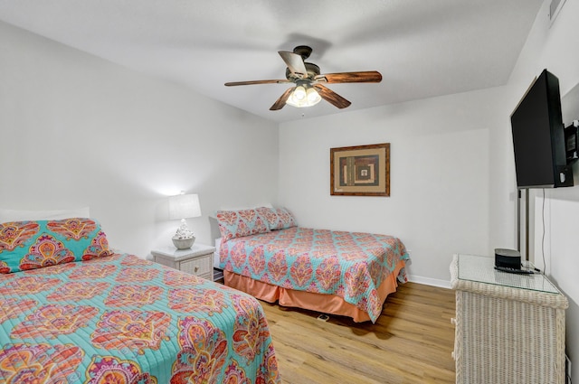 291 Scenic Gulf Dr Unit 400, Miramar Beach, FL 32550 - bedroom with light wood finished floors and a ceiling fan