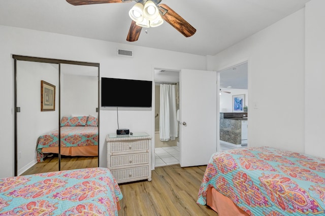 291 Scenic Gulf Dr Unit 400, Miramar Beach, FL 32550 - bedroom with wood finished floors, a closet, and a ceiling fan