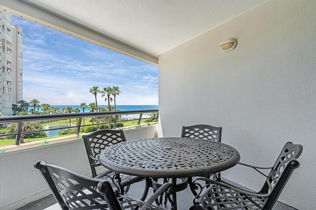 291 Scenic Gulf Dr Unit 400, Miramar Beach, FL 32550 - balcony featuring a water view and outdoor dining area