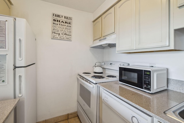 3722 E Co Highway 30a 3 3, Santa Rosa Beach, FL 32459 - kitchen featuring under cabinet range hood, white appliances, light tile patterned floors, and light stone counters