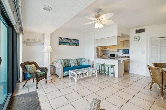 3722 E Co Highway 30a 3 3, Santa Rosa Beach, FL 32459 - living area with light tile patterned floors and a ceiling fan
