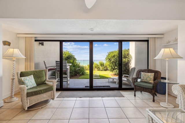 3722 E Co Highway 30a 3 3, Santa Rosa Beach, FL 32459 - living area featuring light tile patterned floors, healthy amount of natural light, and a ceiling fan