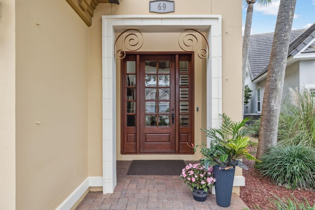 69 Cobalt Ln, Miramar Beach, FL 32550 - doorway to property with stucco siding