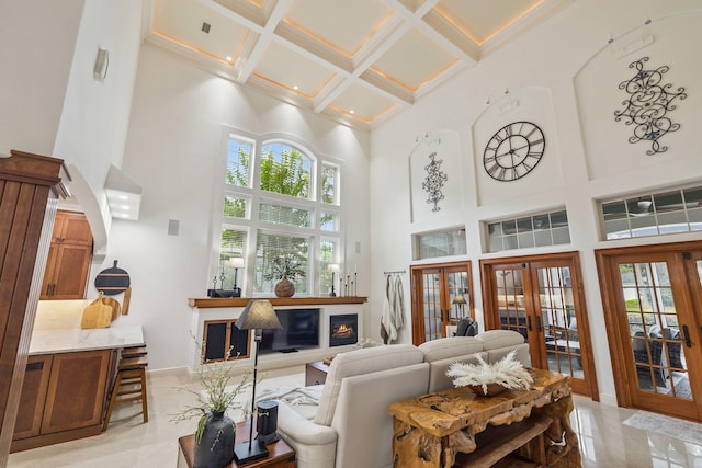 69 Cobalt Ln, Miramar Beach, FL 32550 - living area featuring french doors, a high ceiling, coffered ceiling, healthy amount of natural light, and beamed ceiling
