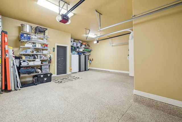 69 Cobalt Ln, Miramar Beach, FL 32550 - garage with baseboards and a garage door opener
